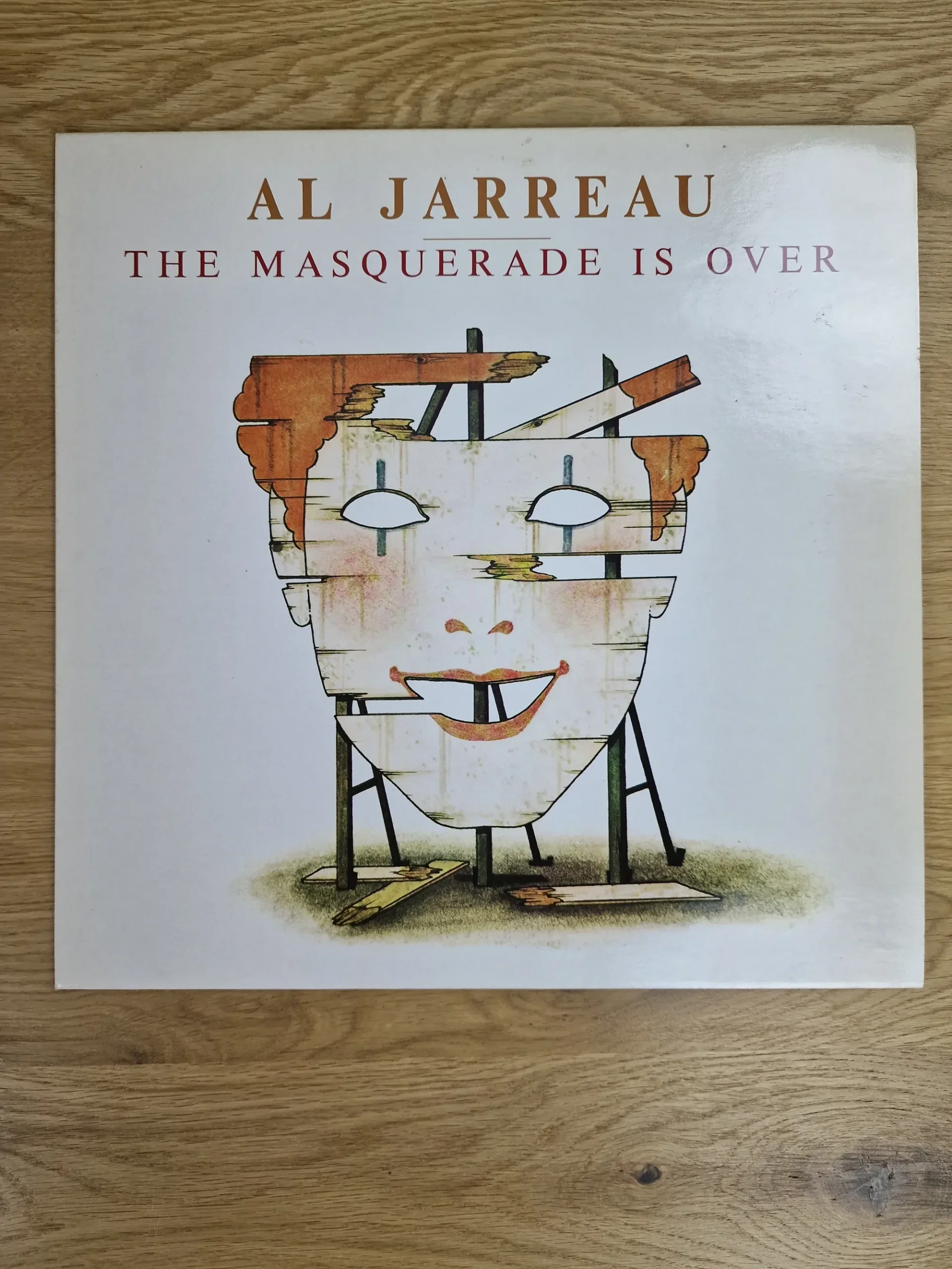 Vorderseite der Vinyl LP Al Jarreau - The Masquerade Is Over mit Illustration einer Holzmaske