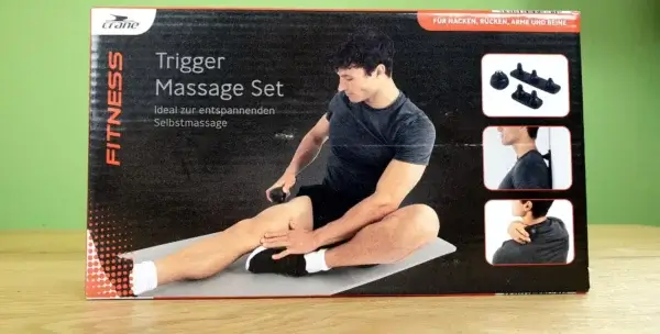 Das crane Trigger Massage Set in seiner Verpackung von vorne