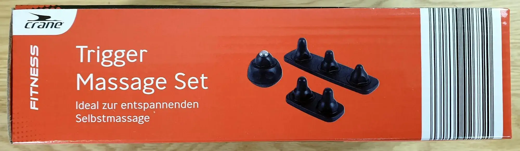 Das crane Trigger Massage Set in seiner Verpackung von der Seite