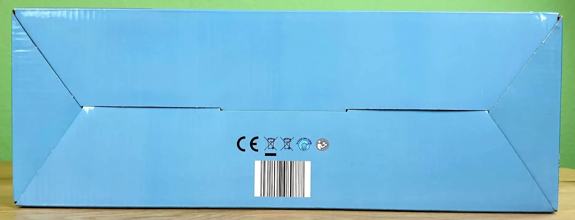 Elektrische Körperbürste in seiner Verpackung von unten.