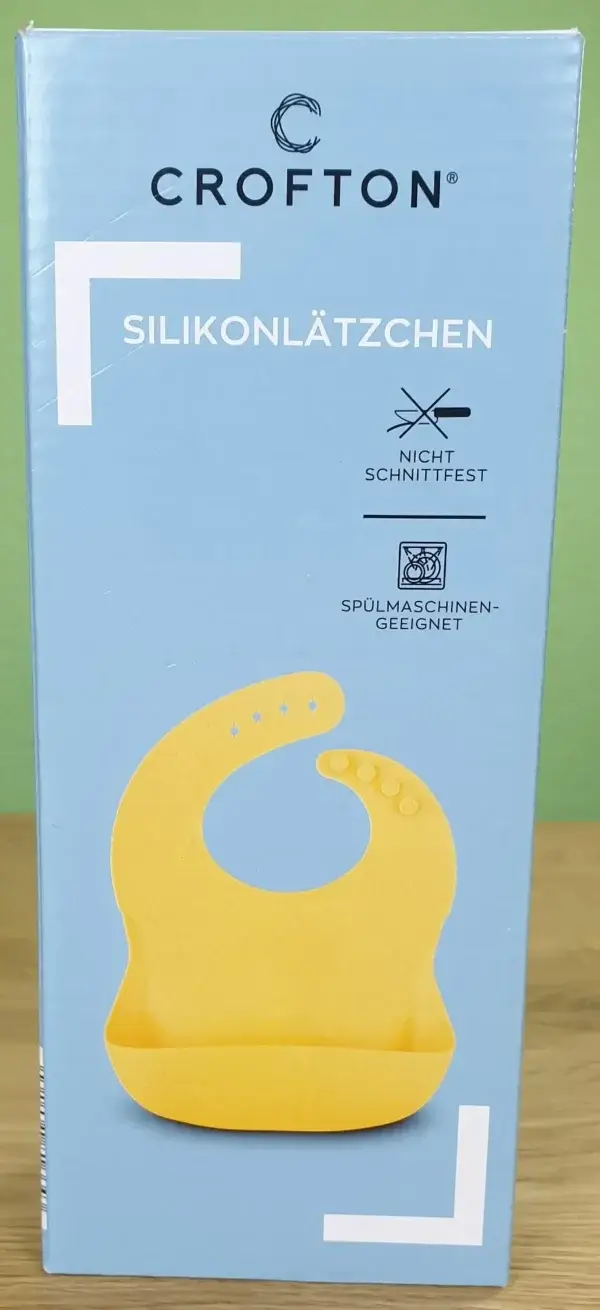 CROFTON Silikonlätzchen in seiner Verpackung von vorne.