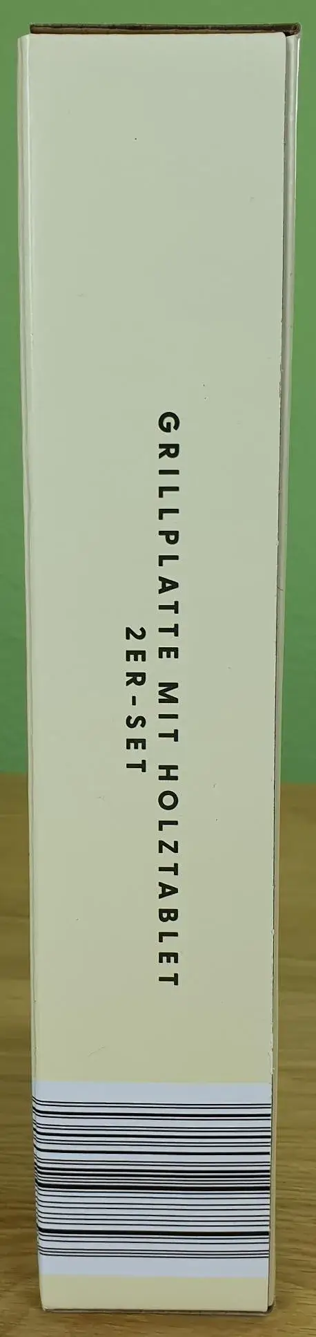 Grillplatte mit Holzbrett 2er-Set in klein von Nelson Müller in Ihrer Verpackung von der Seite.