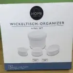 Das HOME CREATION Wickeltisch-Organizer 6-tlg. Set in Weiß in seiner Verpackung von vorne.