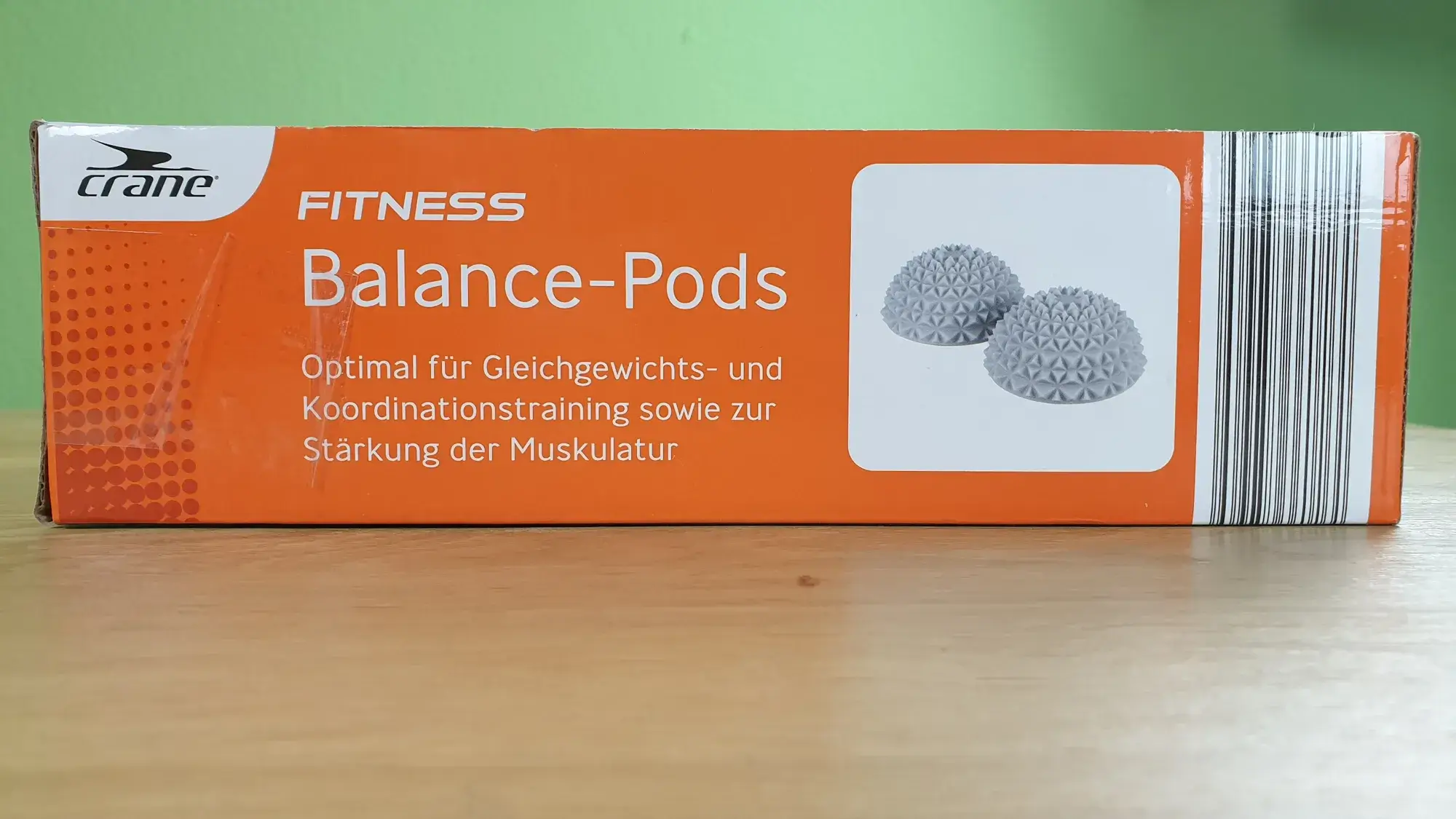 Der crane Balance-Pod in seiner Verpackung von der Seite.