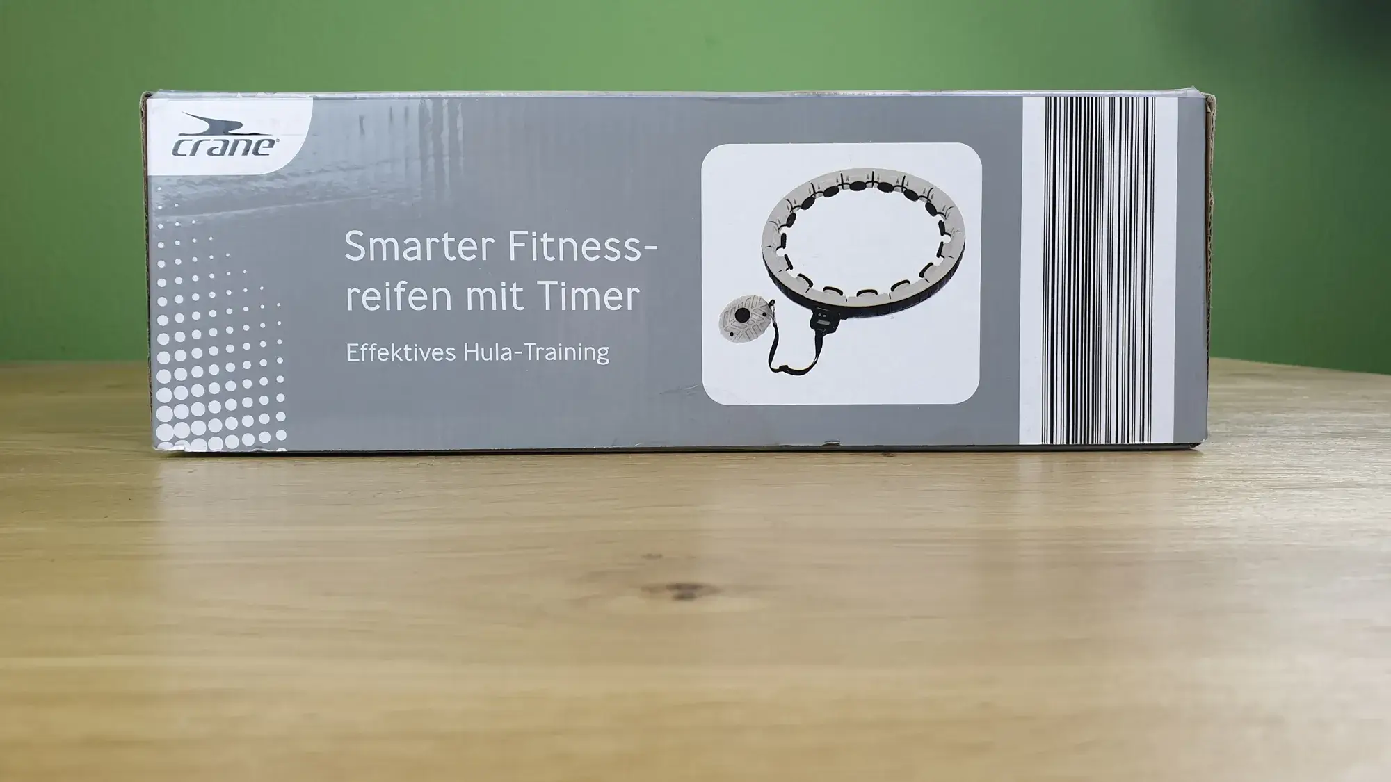 Der crane smarter Fitnessreifen mit Timer in seiner Verpackung von der Seite.