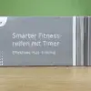 Der crane smarter Fitnessreifen mit Timer in seiner Verpackung von der Seite.