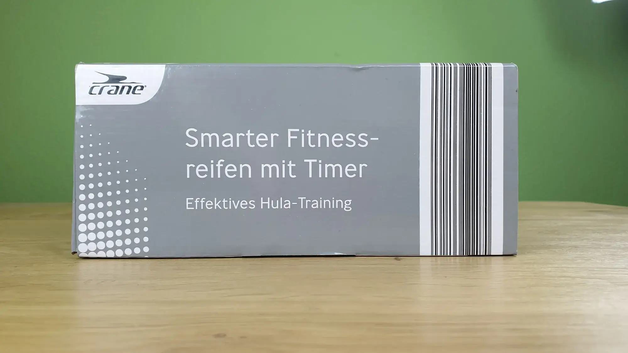 Der crane smarter Fitnessreifen mit Timer in seiner Verpackung von der Seite.