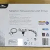 Der crane smarter Fitnessreifen mit Timer in seiner Verpackung von hinten.