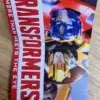Das Etikett des Kinderregenschirm Transformers (die mit den Autos aus dem Film) von vorn.