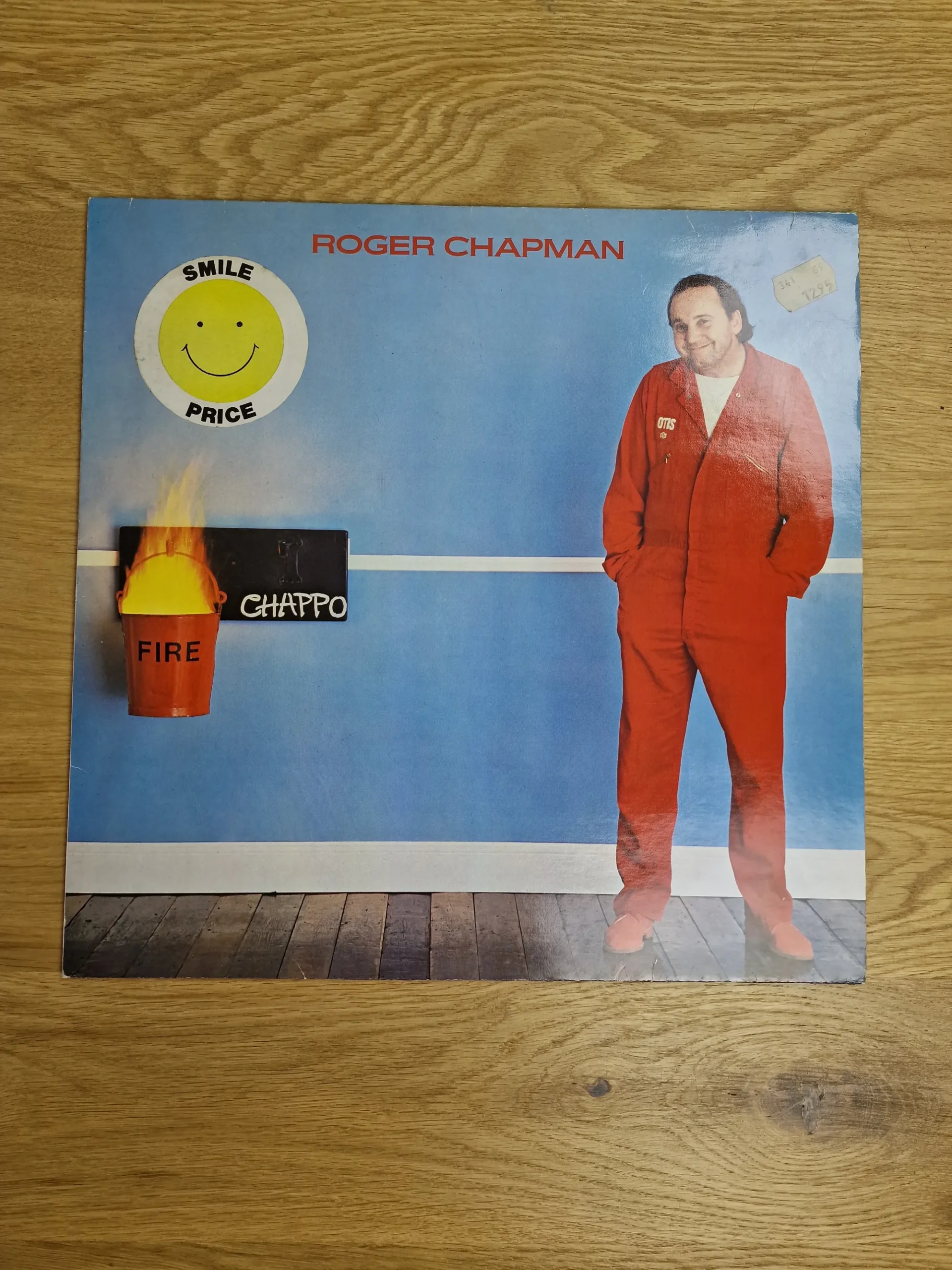 Vorderseite des Album-Covers Chappo von Roger Chapman im roten Overall