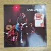 Vorderseite der Live Cream Vinyl Schallplatte von Cream mit Band-Konzertfoto