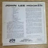 Rückseite des Vinyl-Covers Burnin' von John Lee Hooker mit vollständiger Tracklist und Biografie