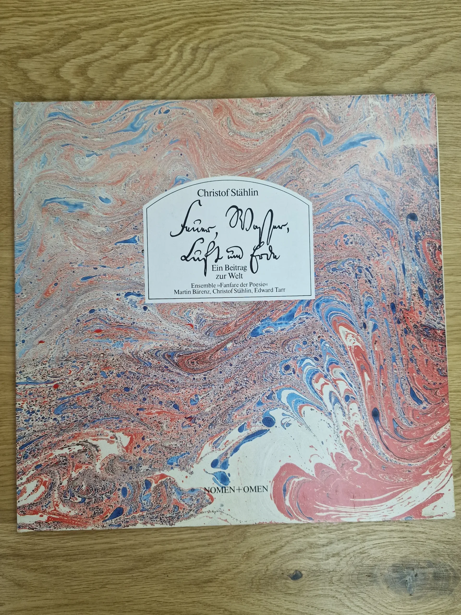 Vorderseite des Vinyl-Albumcovers Feuer Wasser Luft und Erde von Christof Stählin mit kunstvollem Marmormuster
