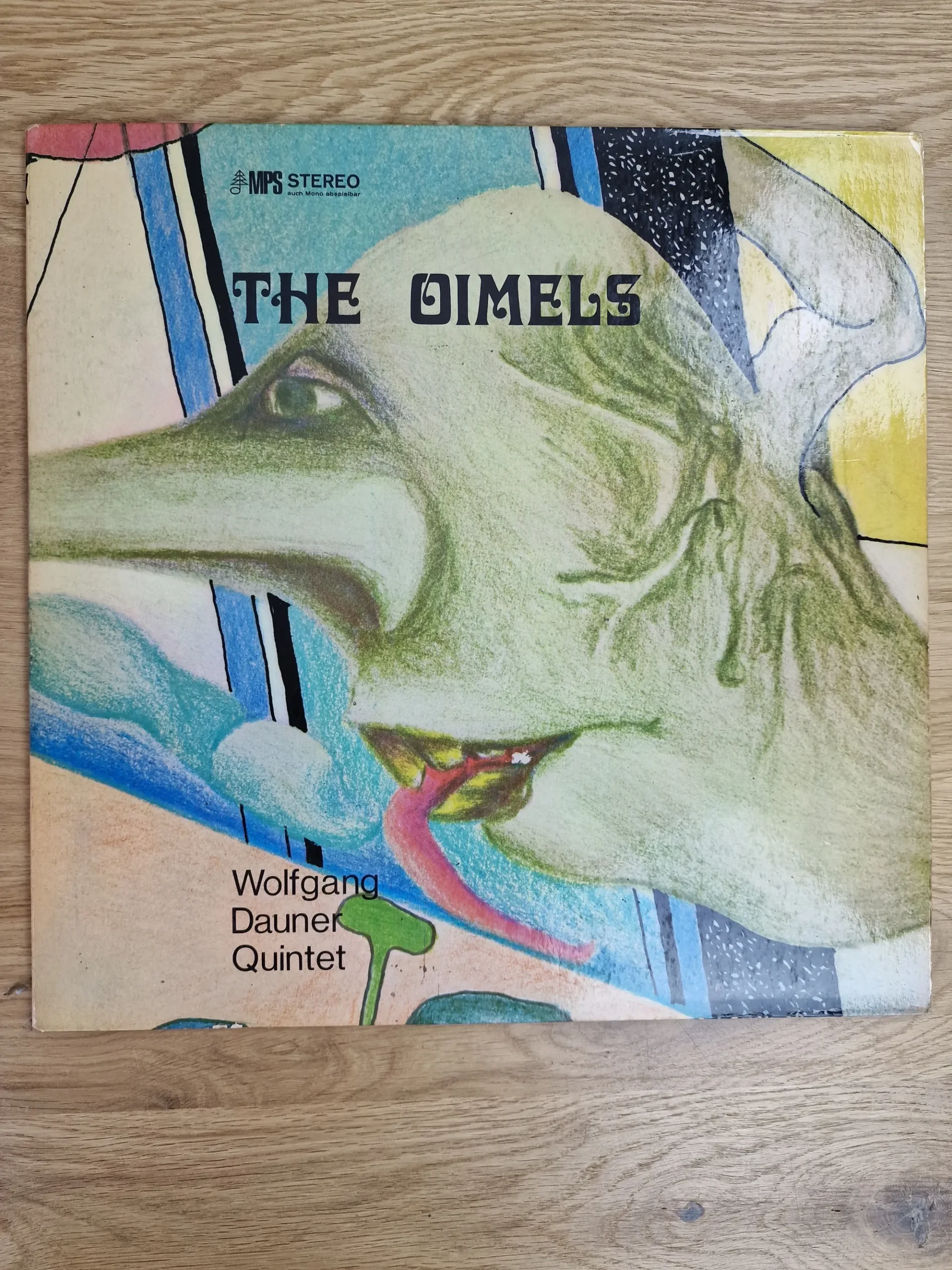 Wolfgang Dauner Quintet – The Oimels (Vinyl LP, MPS Records) 1 Vorderseite des Vinyl-Albums The Oimels vom Wolfgang Dauner Quintet auf MPS Records mit grünem Fabelwesen-Motiv
