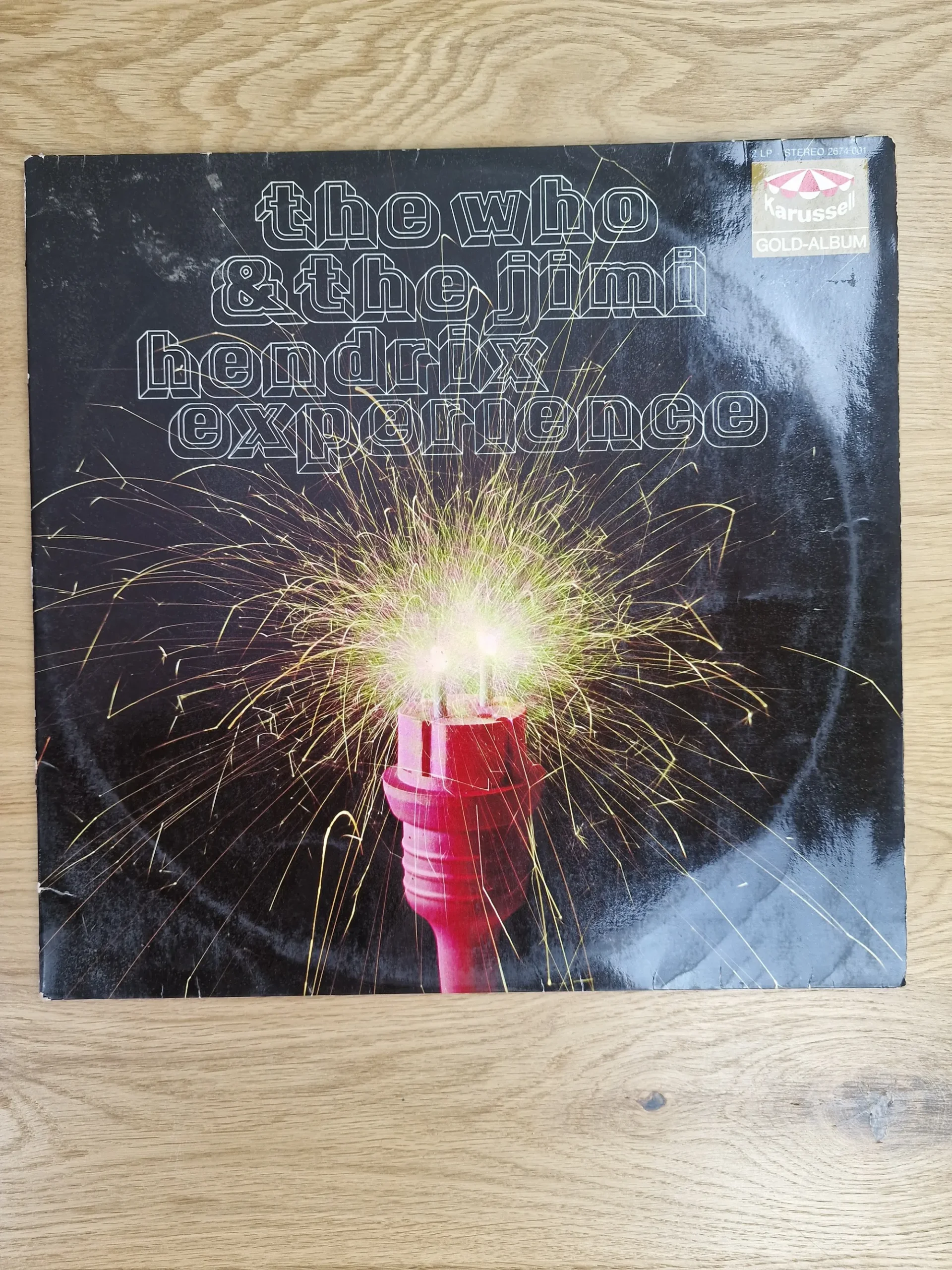 Vorderseite der Vinyl Doppel-LP The Who & The Jimi Hendrix Experience Gold-Album mit sprühendem Steckermotiv