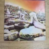 Vorderseite des Vinyl-Albumcovers Houses of the Holy von Led Zeppelin