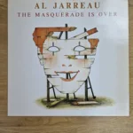 Vorderseite der Vinyl LP Al Jarreau - The Masquerade Is Over mit Illustration einer Holzmaske