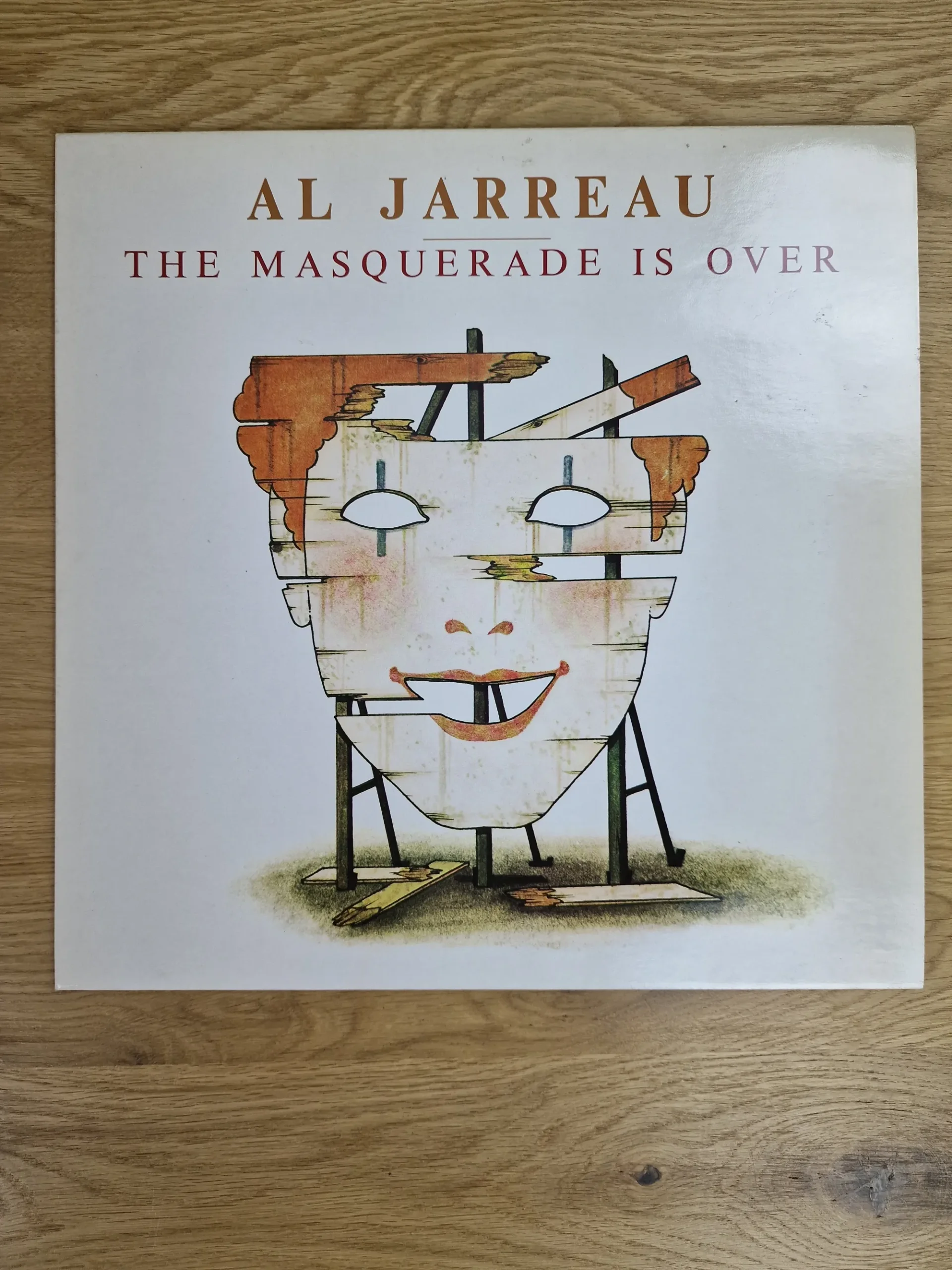 Vorderseite der Vinyl LP Al Jarreau - The Masquerade Is Over mit Illustration einer Holzmaske