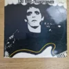 Vorderseite des Vinyl-Albumcovers Transformer von Lou Reed mit ikonischem Schwarz-Weiß-Porträt
