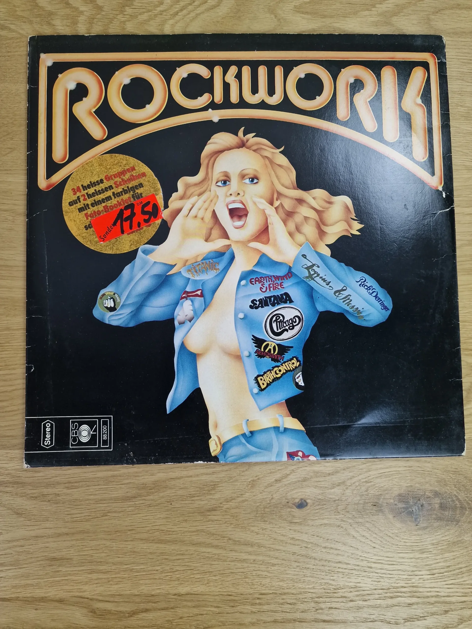 Vorderseite der Vinyl Doppel-LP Rockwork von 1975 mit Illustration einer Frau im Jeanshemd und Bandlogos